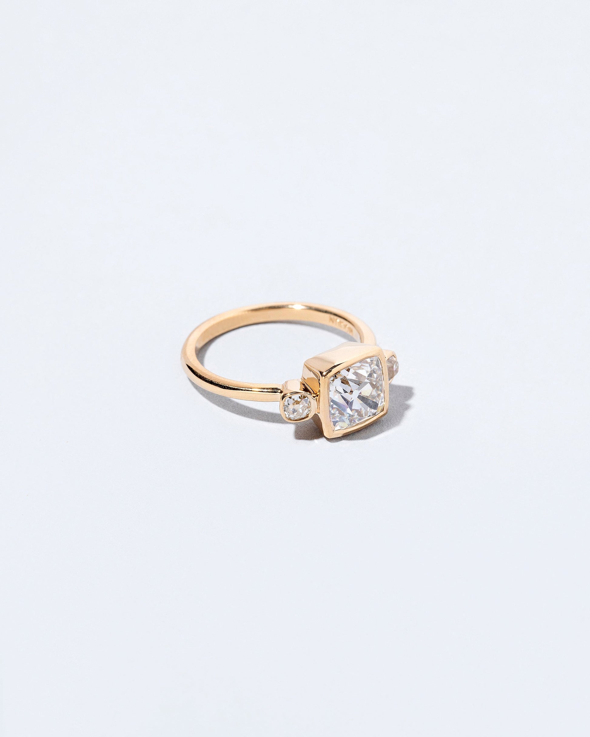  Genesis Ring on light color background.