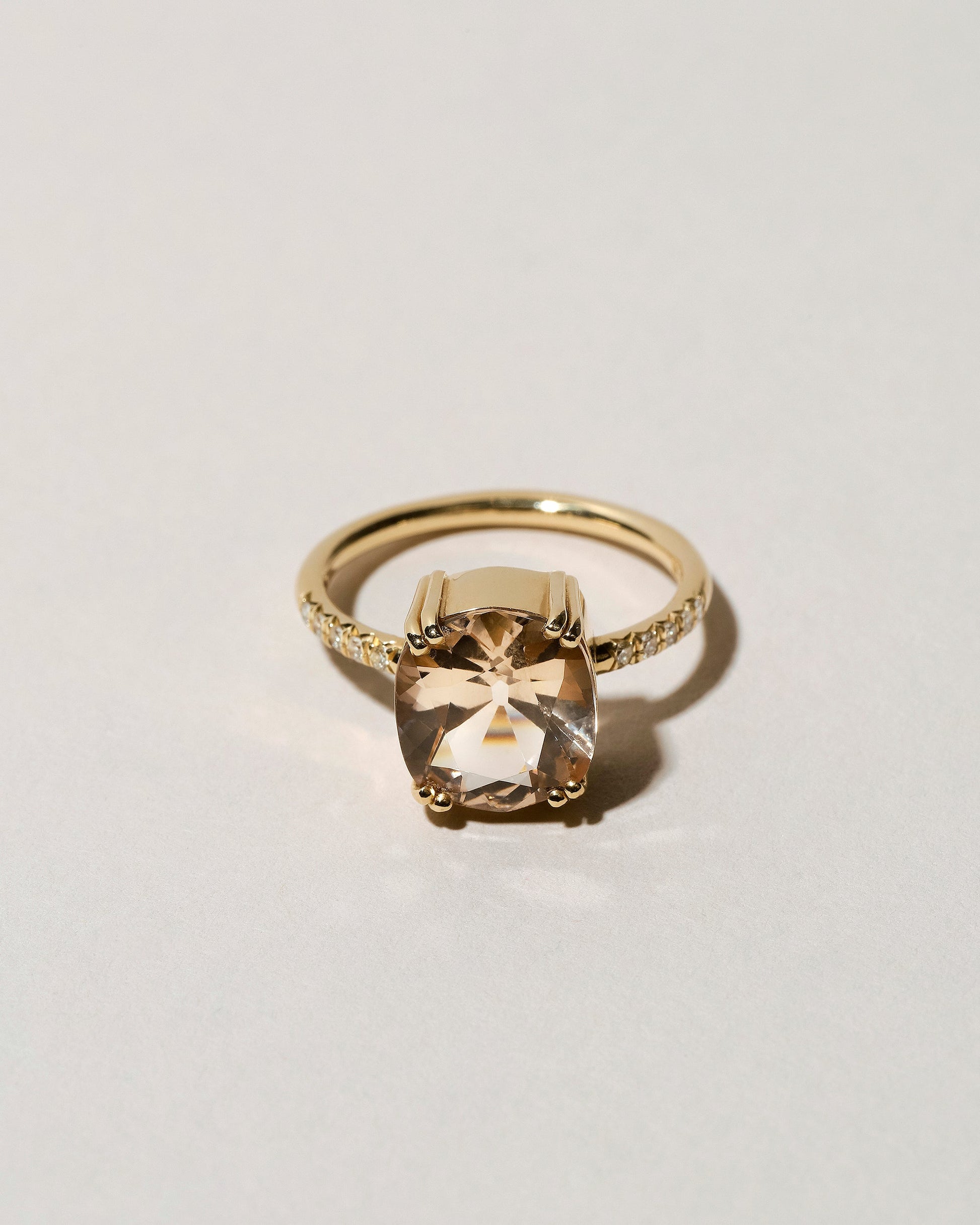 Morganite Solitaire Ring on light color background.