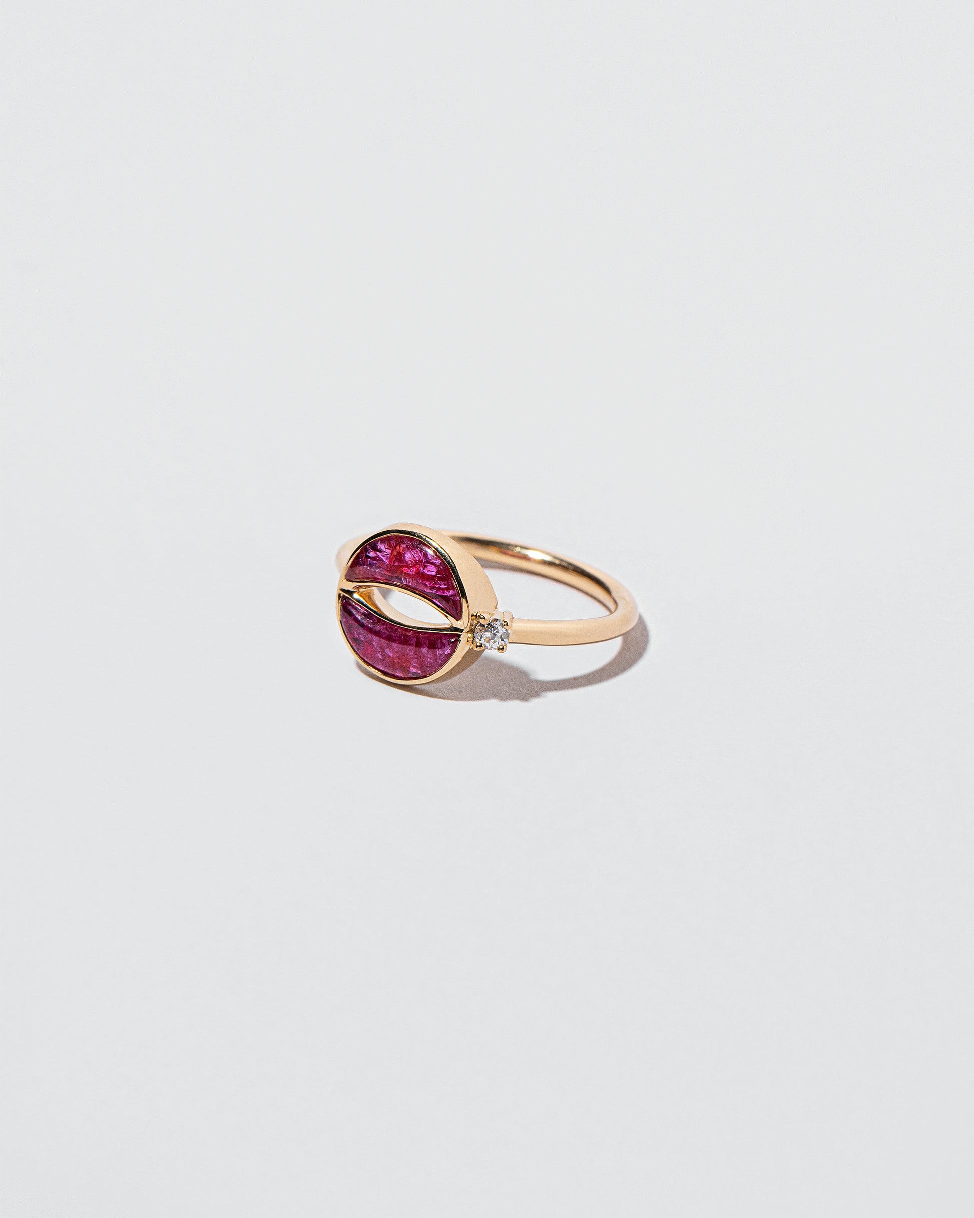 Closeup details of the Rebirth Ring on light color background.
