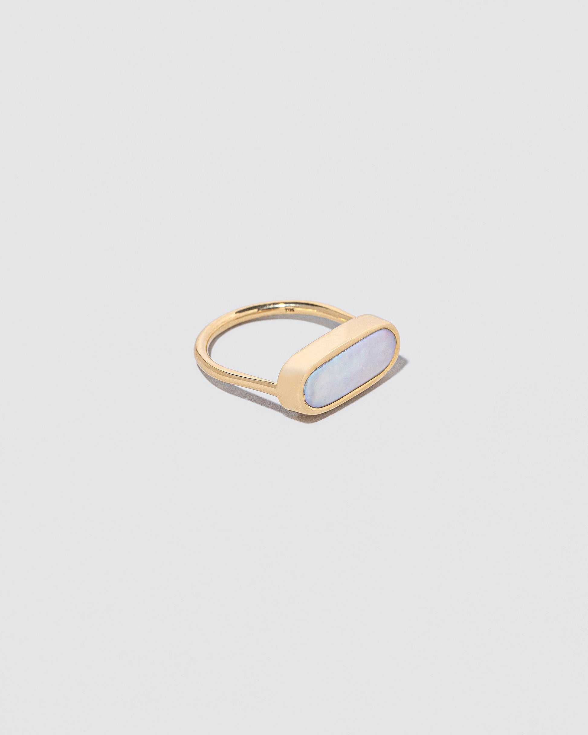 View from the side of the Antaeus Ring on light color background.