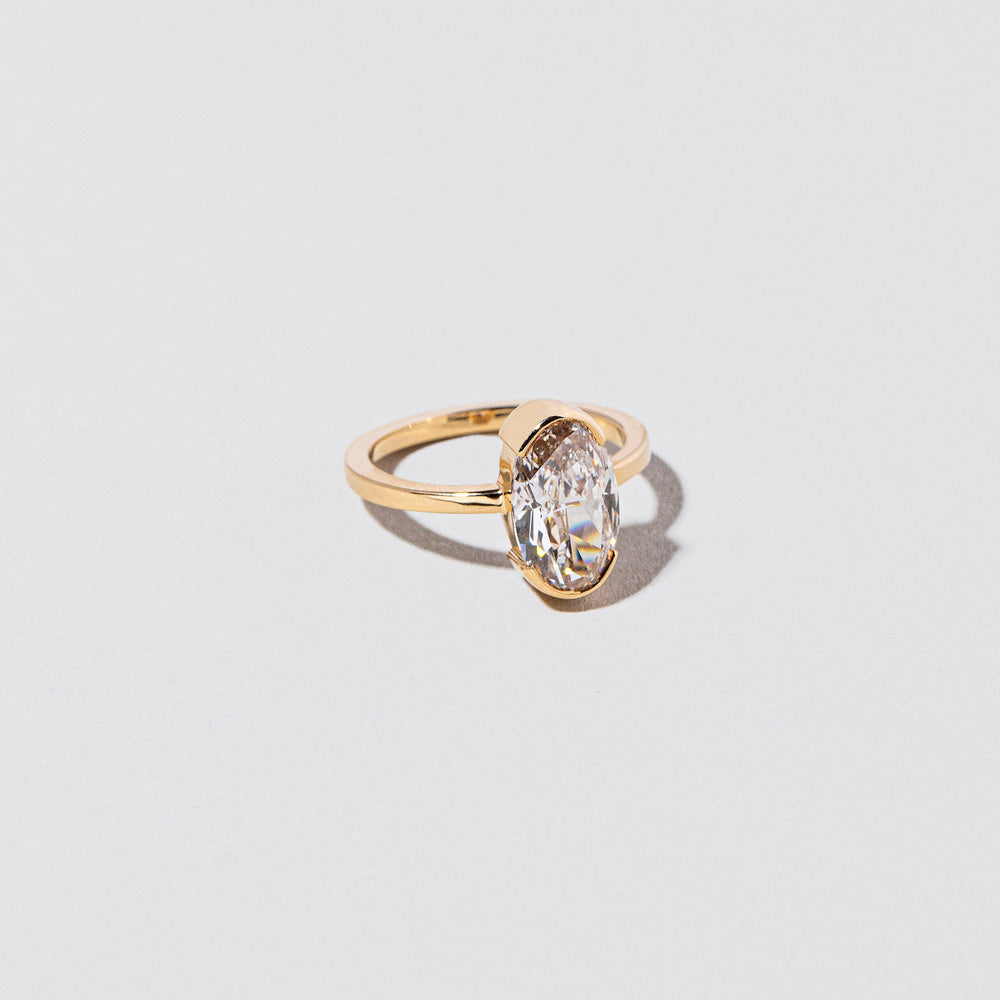 product_details::Closeup details of the Order Ring on light color background.