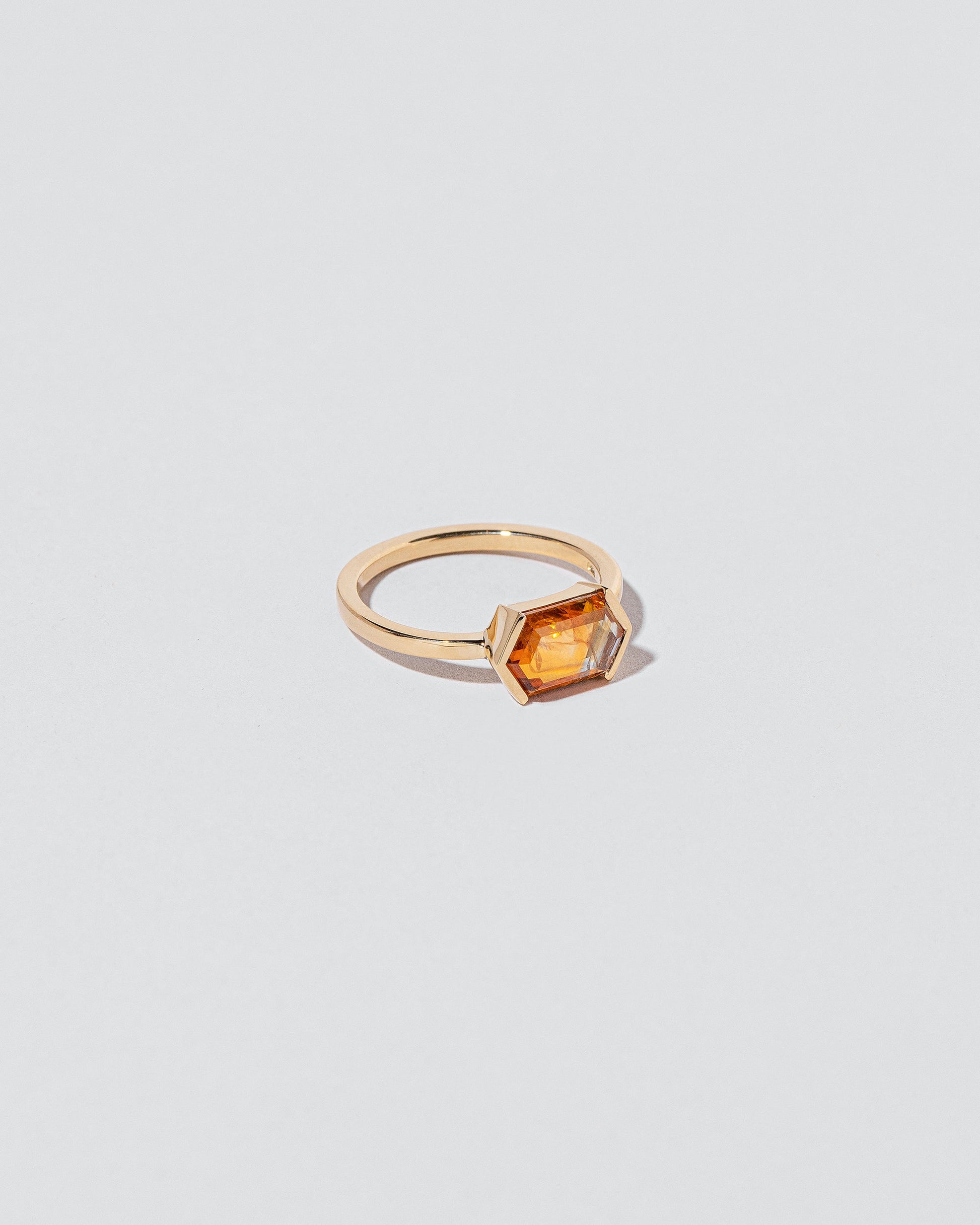 View from the side of the Dawnstar Ring on light color background.