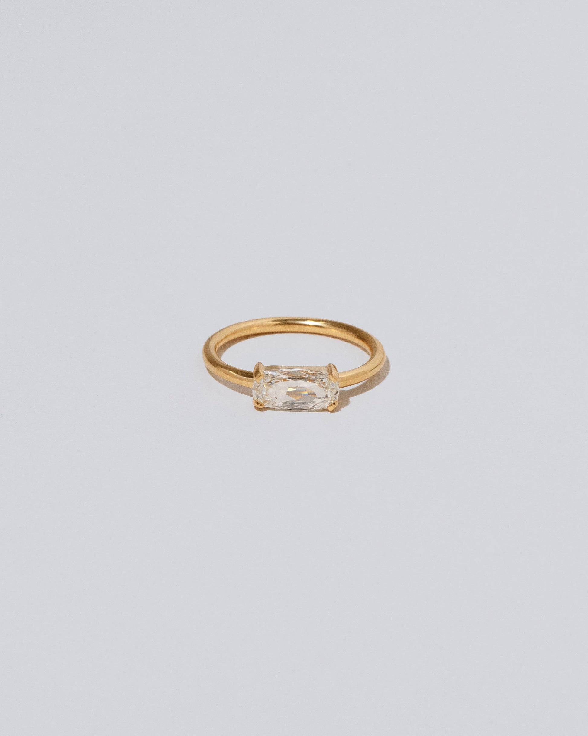 Adage Ring on light color background.