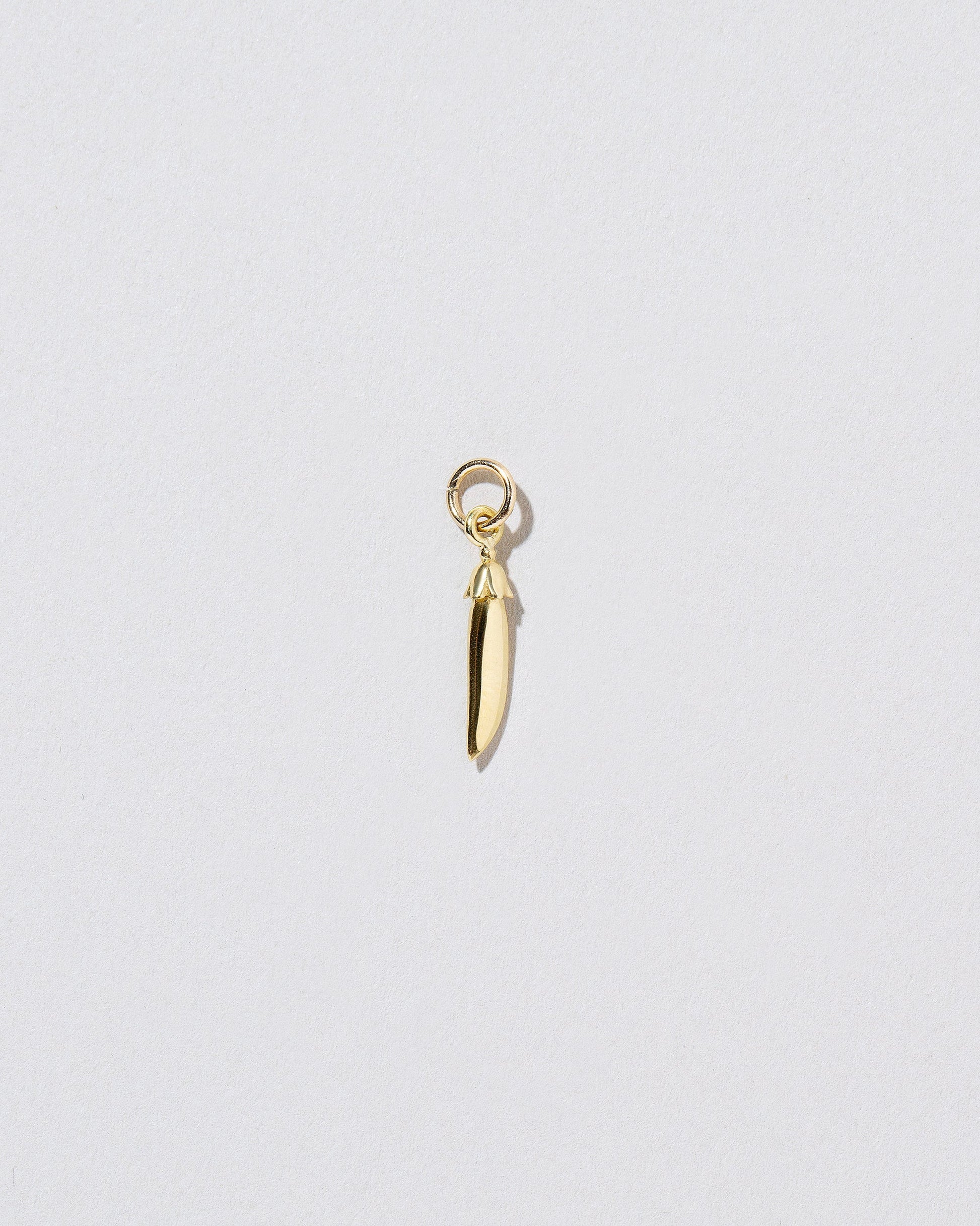 Solid Snap Pea Charm on light color background.