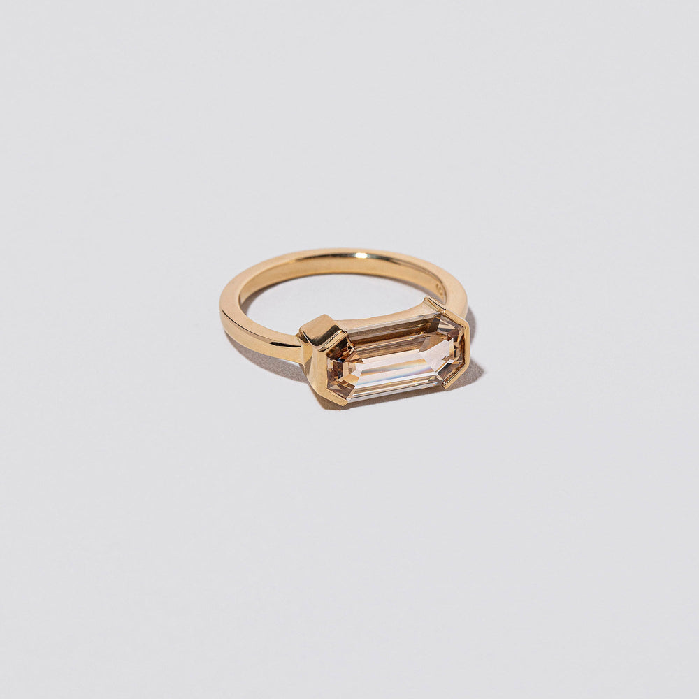 product_details::Closeup details of the Book of Love Ring on light color background.