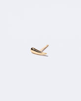 Gold Solid Left Facing One & Others Stud Earring Single on light color background.