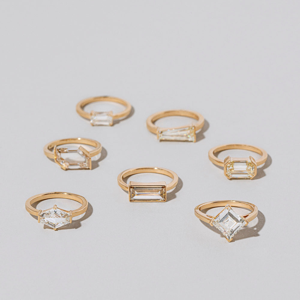 product_details::Group of Born Rings on light color background.
