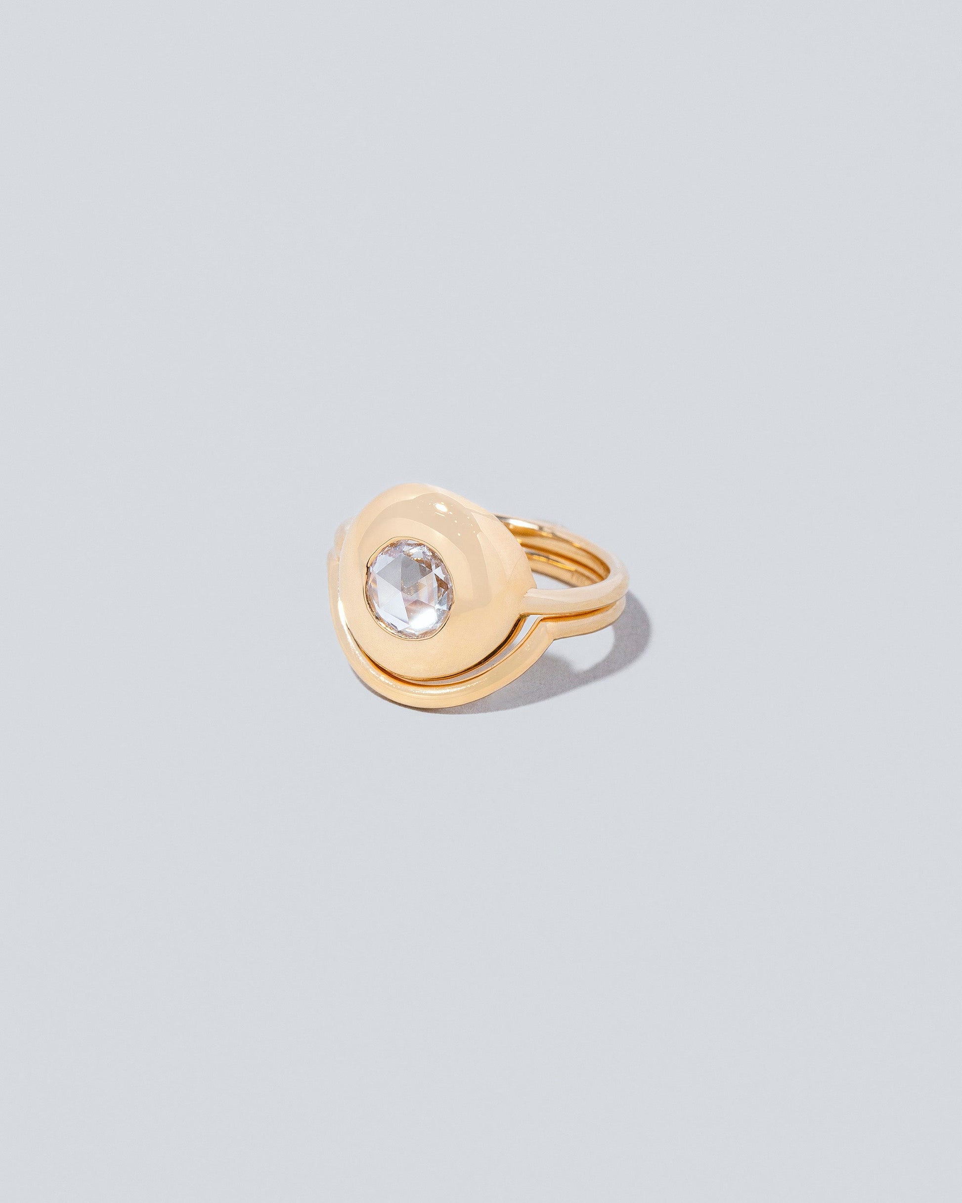 Left side view of Exposition Ring with Exposition Band on light color background.