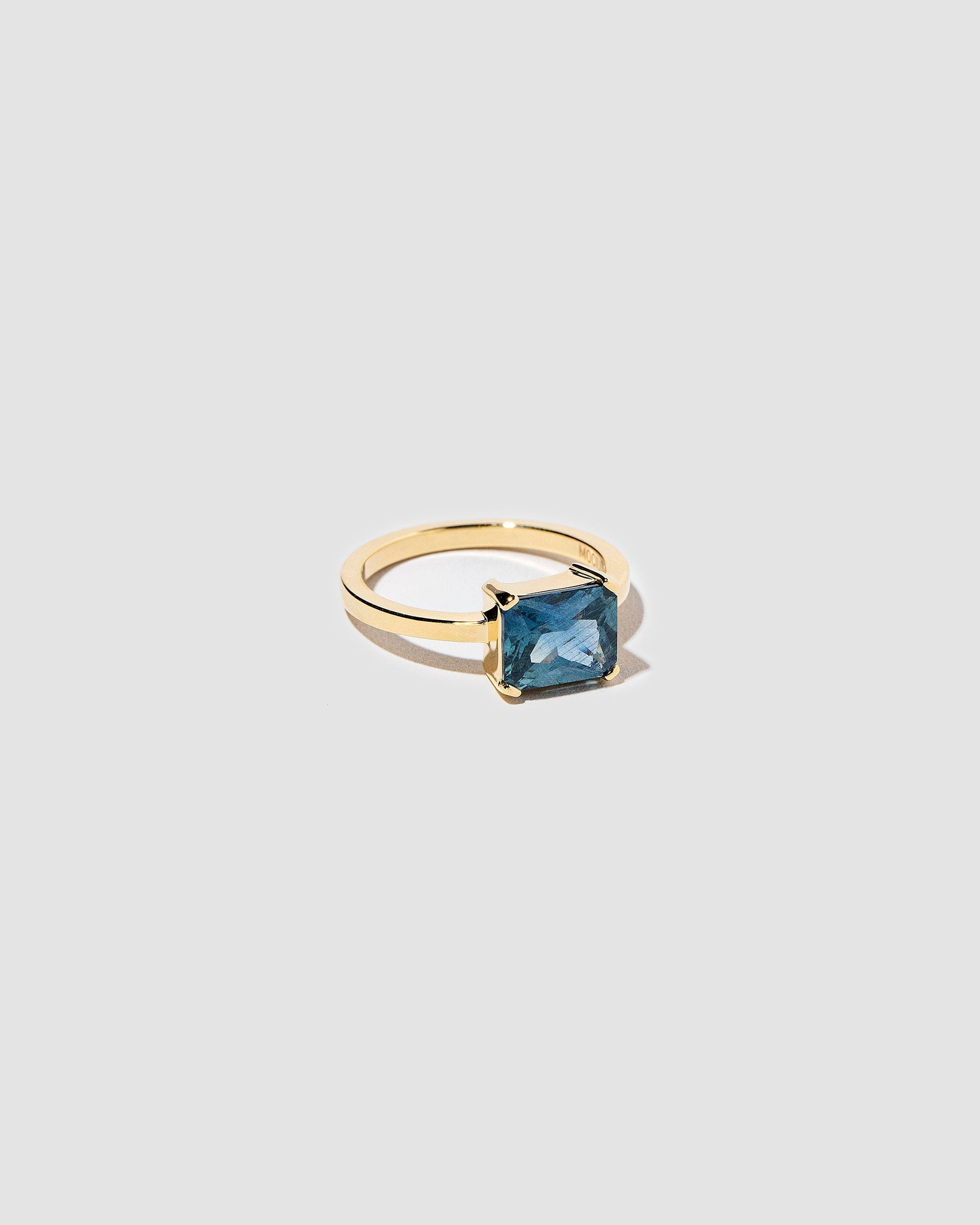 View from the side of the Sea of Love Ring on light color background.