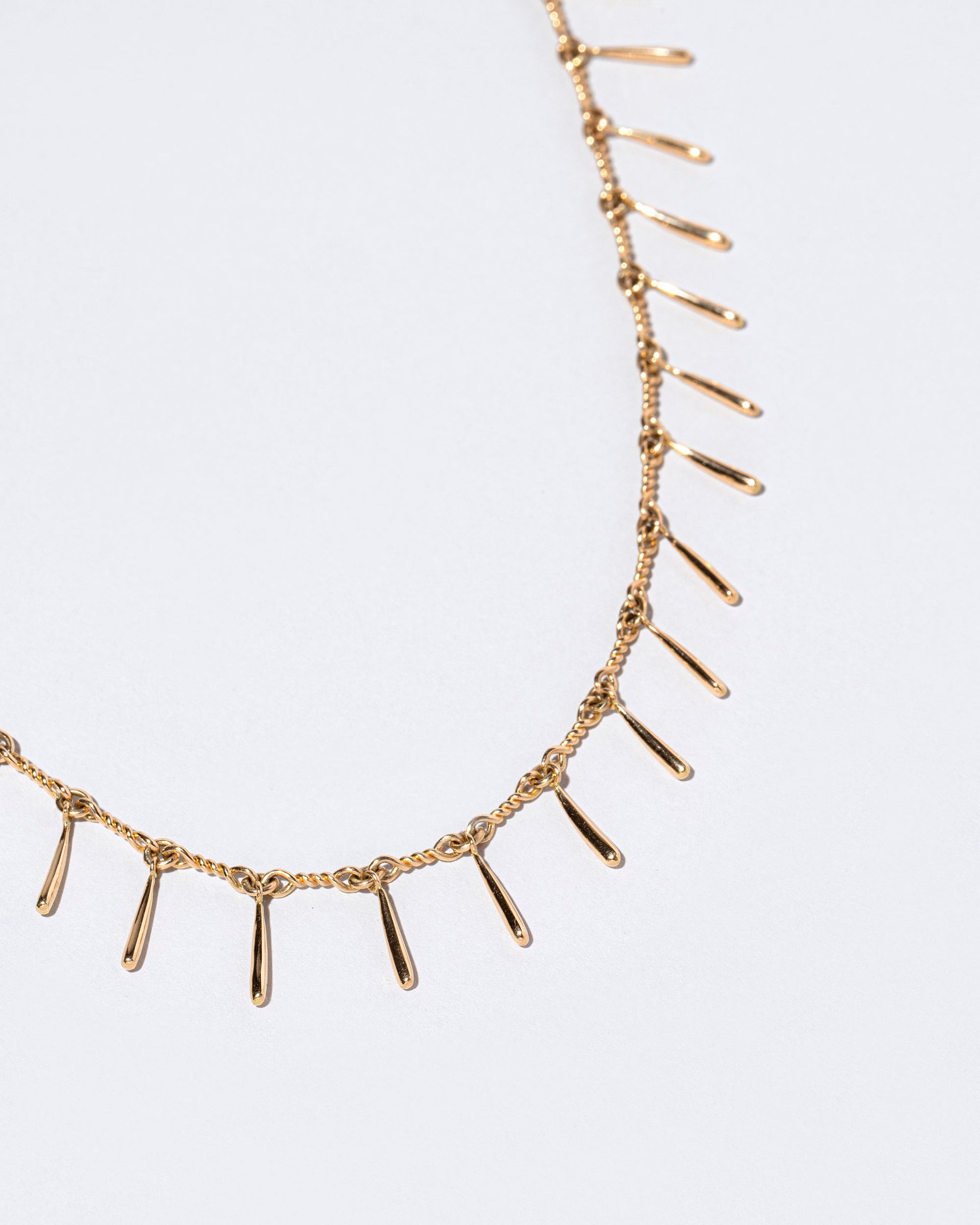  Swaying Necklace on light color background.