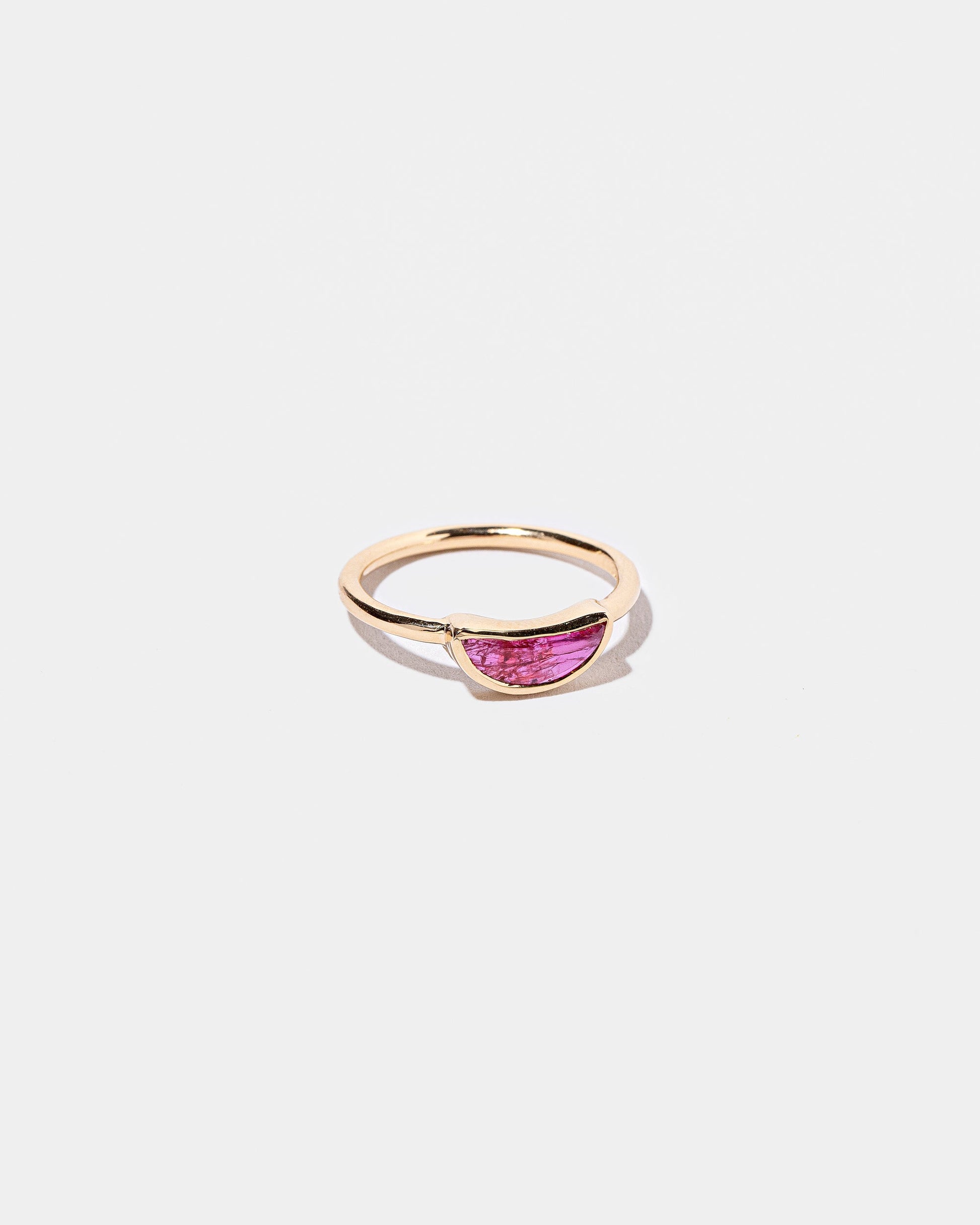 View from the side of the Passion Ring on light color background.