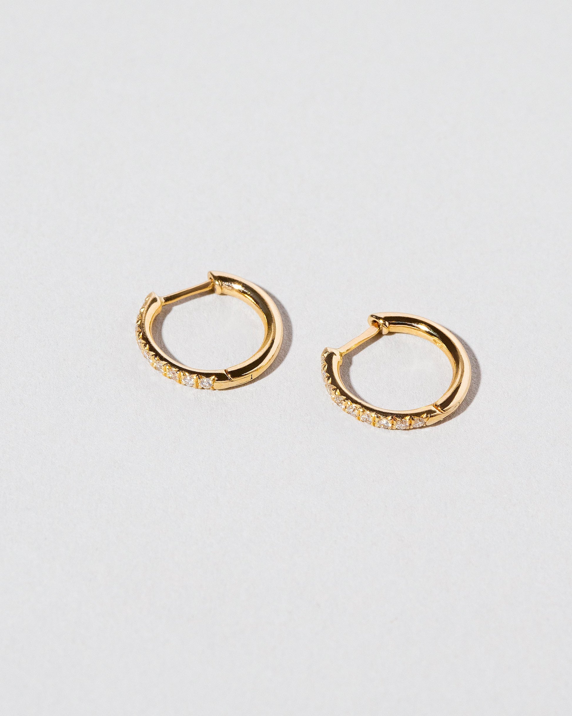 Gold Classic Diamond Snack Hoops on light color background.