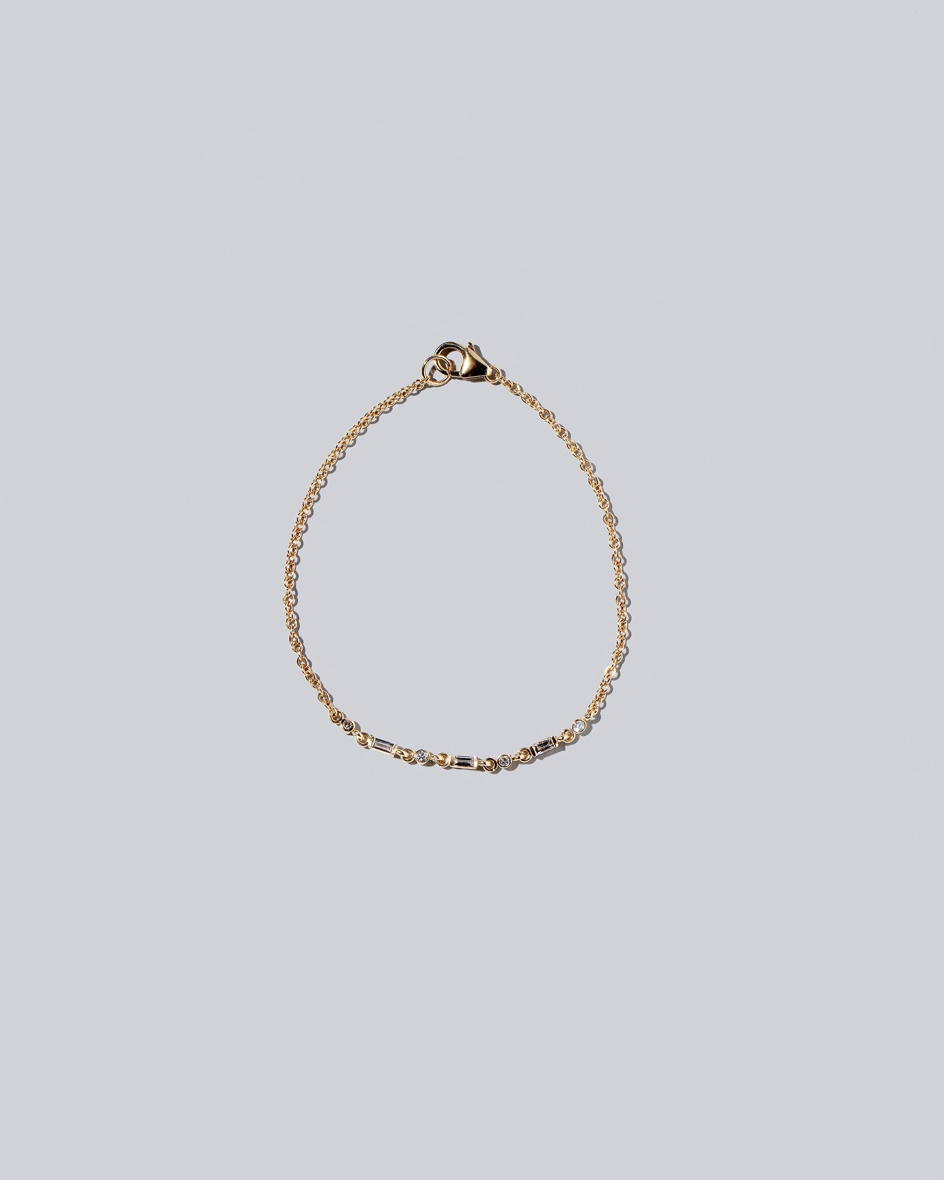 White Diamond Consecutive Building Block Bracelet on light color background.