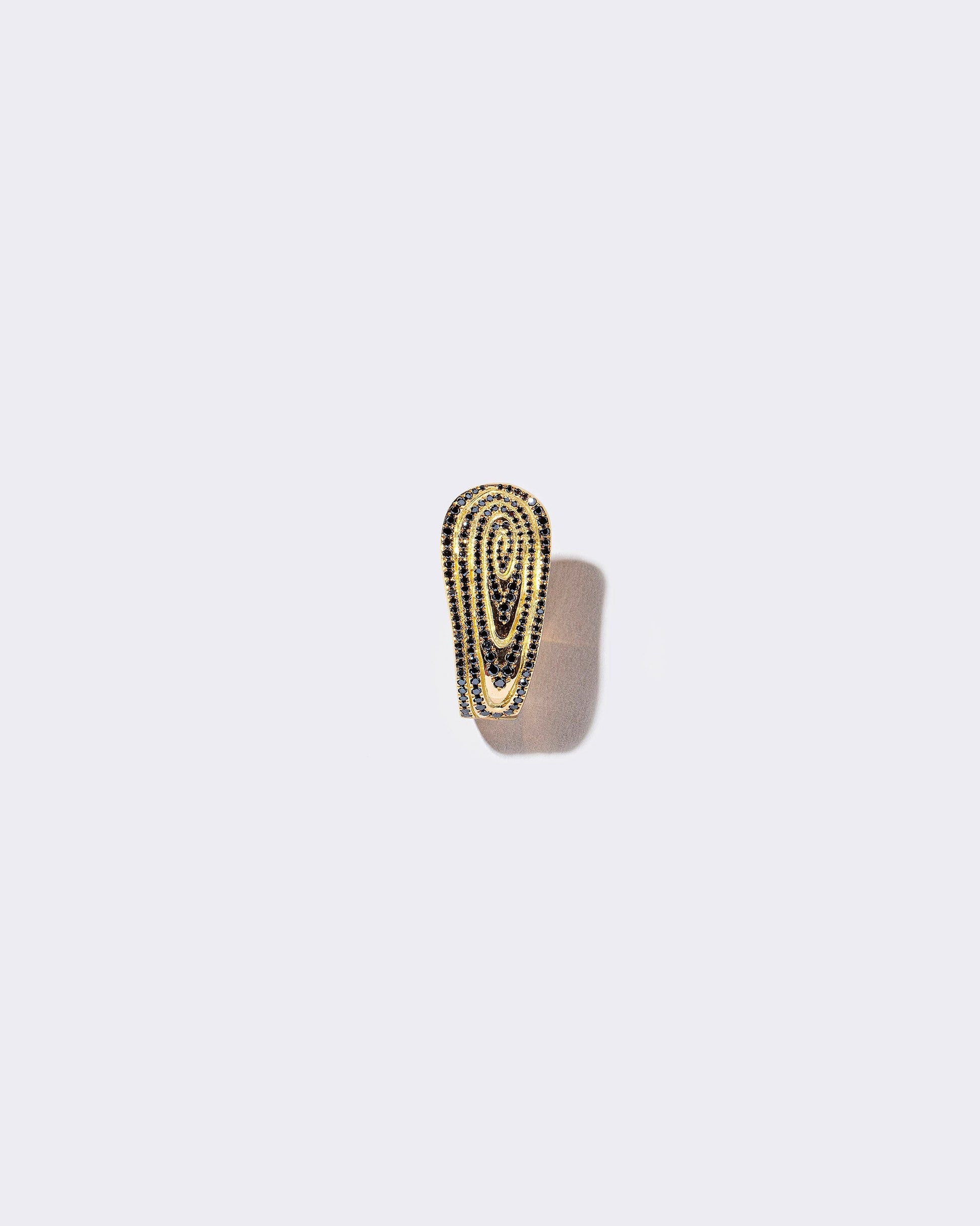 Black Diamond Duality Hoop Earring on light color background.