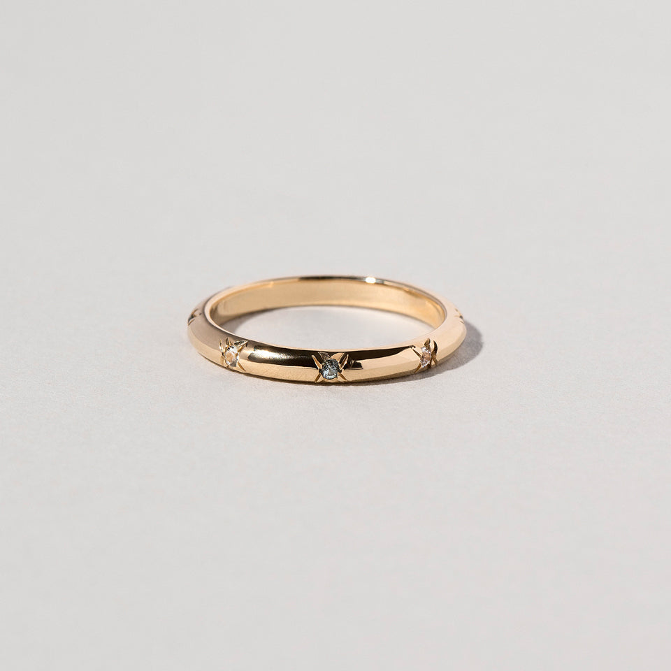 product_details::Blue Sapphire Half Round Studded Band on light color background.