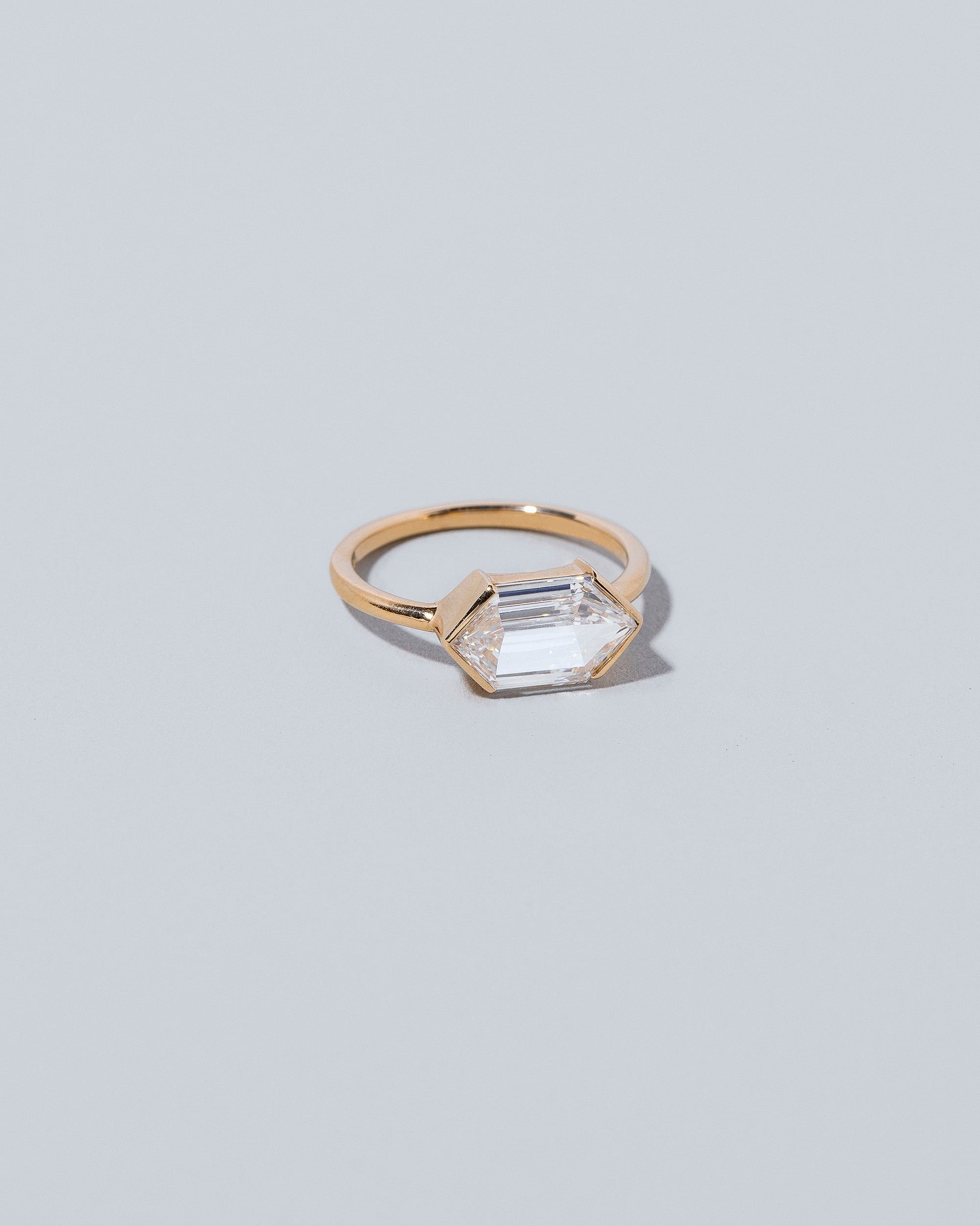 View from the side of the Headstrong Ring on light color background.
