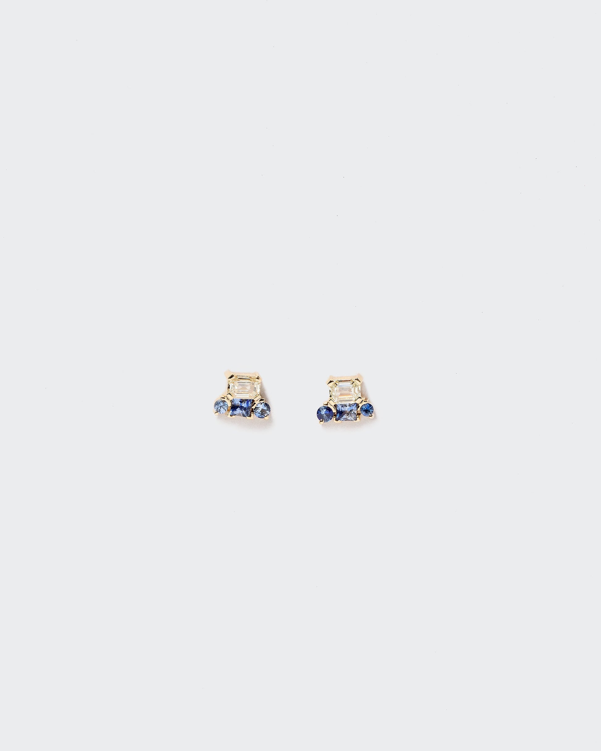 Linear Stud Earrings on light color background.
