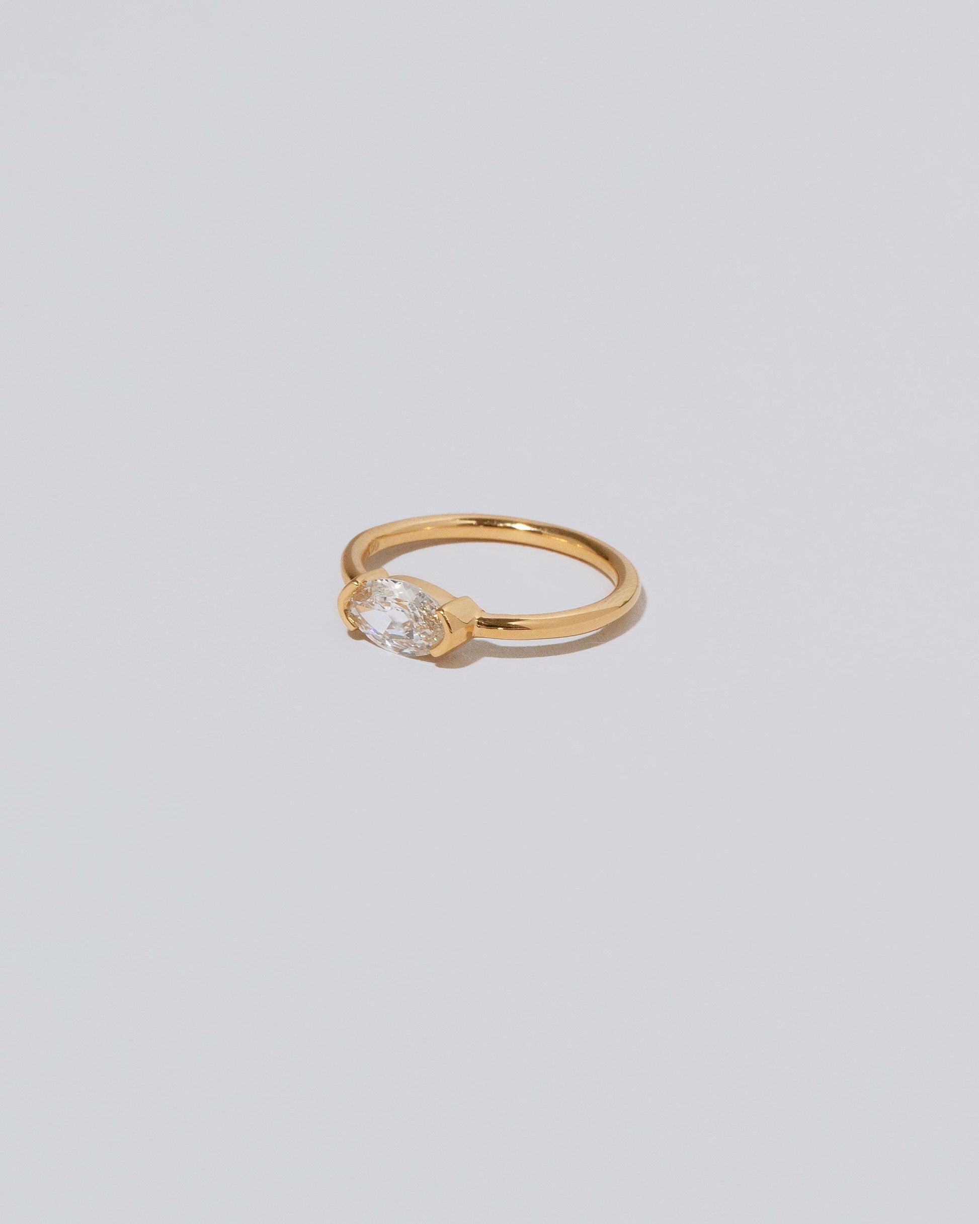 View from the side of the De Coté Ring on light color background.