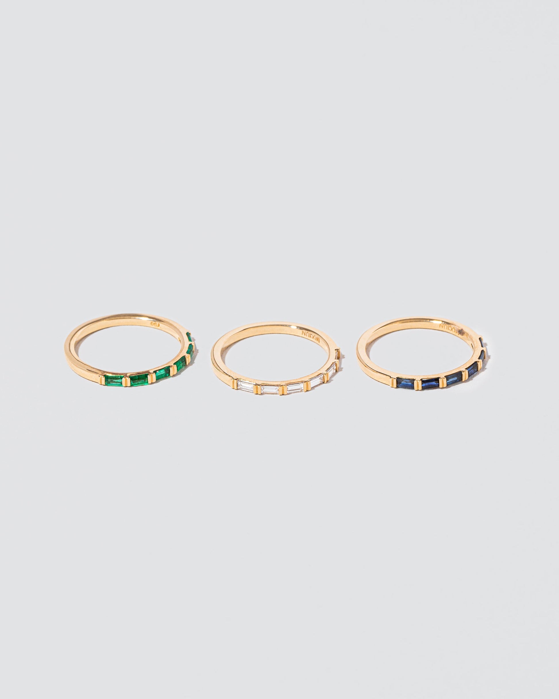 Gold Bar Baguette Bands on light color background.