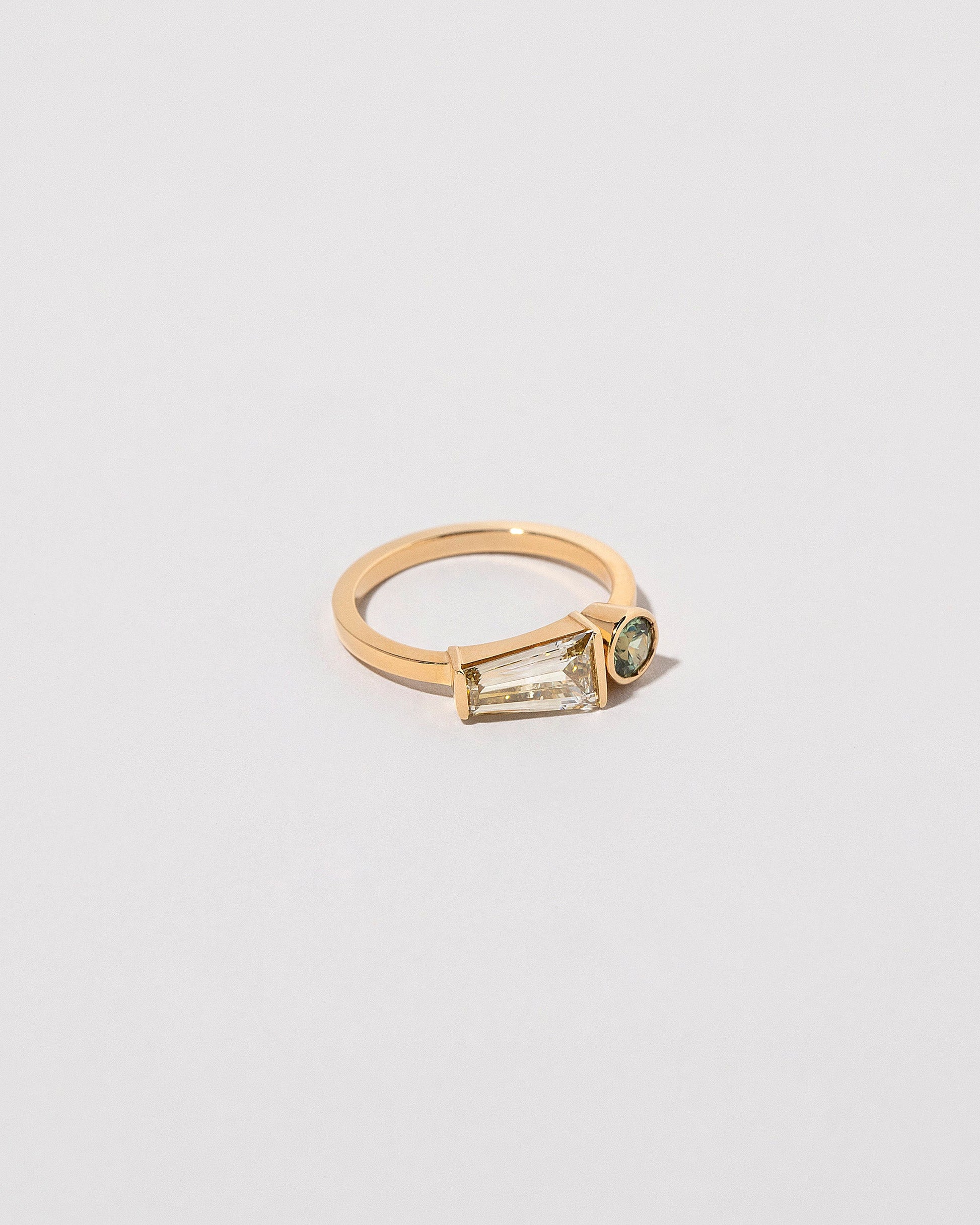  Merret Ring on light color background.