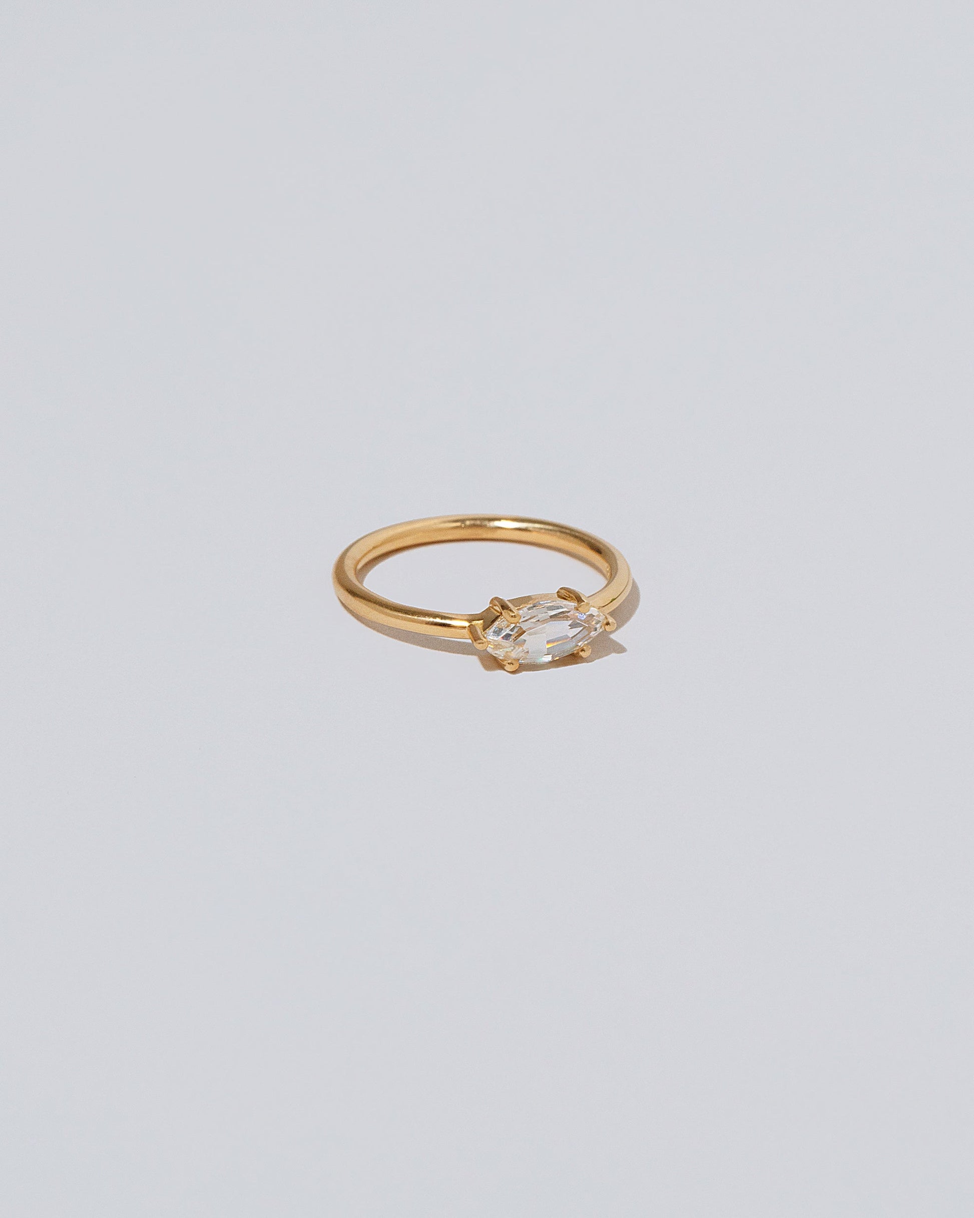 View from the side of the Ouvert Ring on light color background.